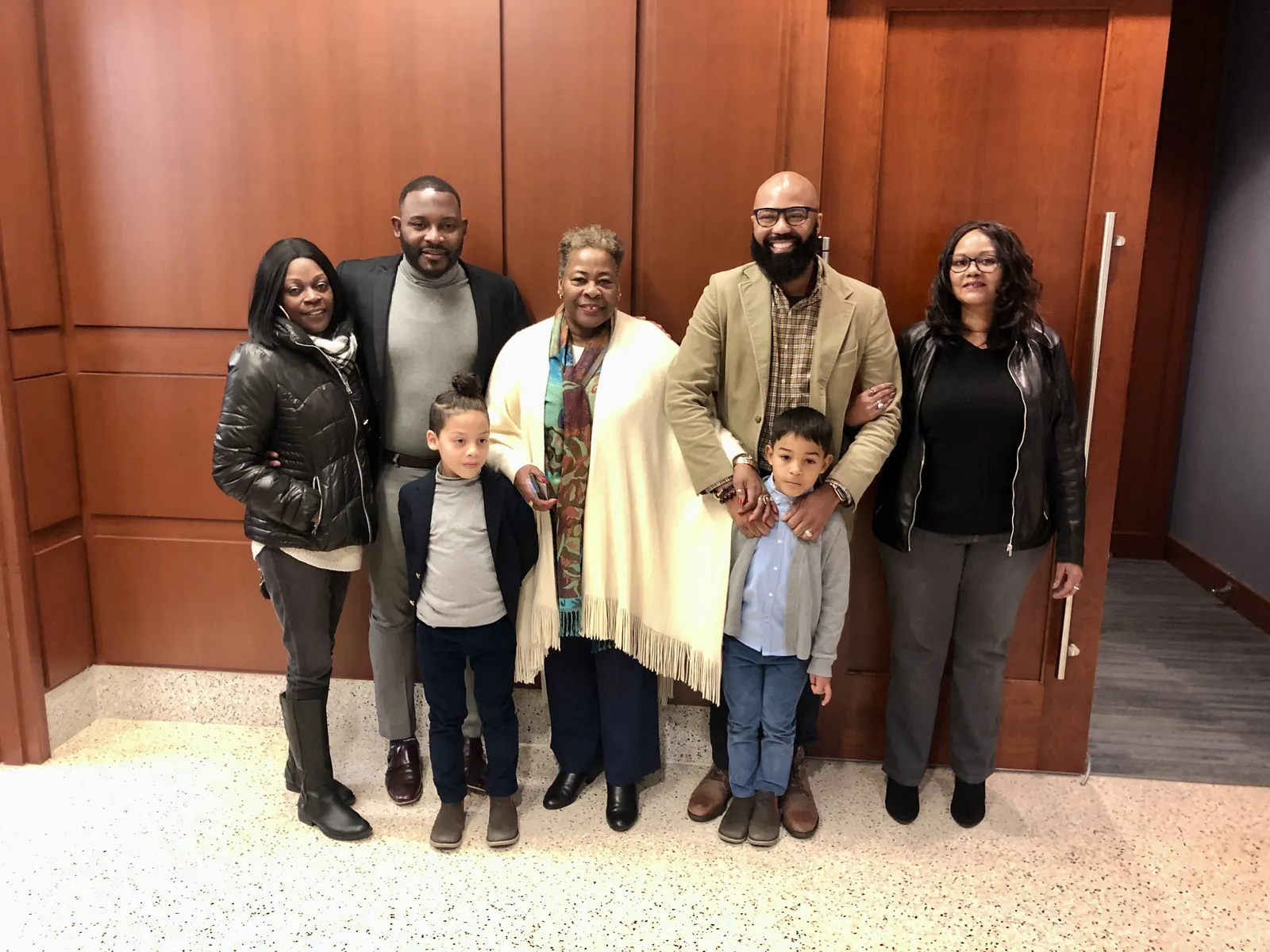 The extended family gathered with Eli and Juan on adoption day