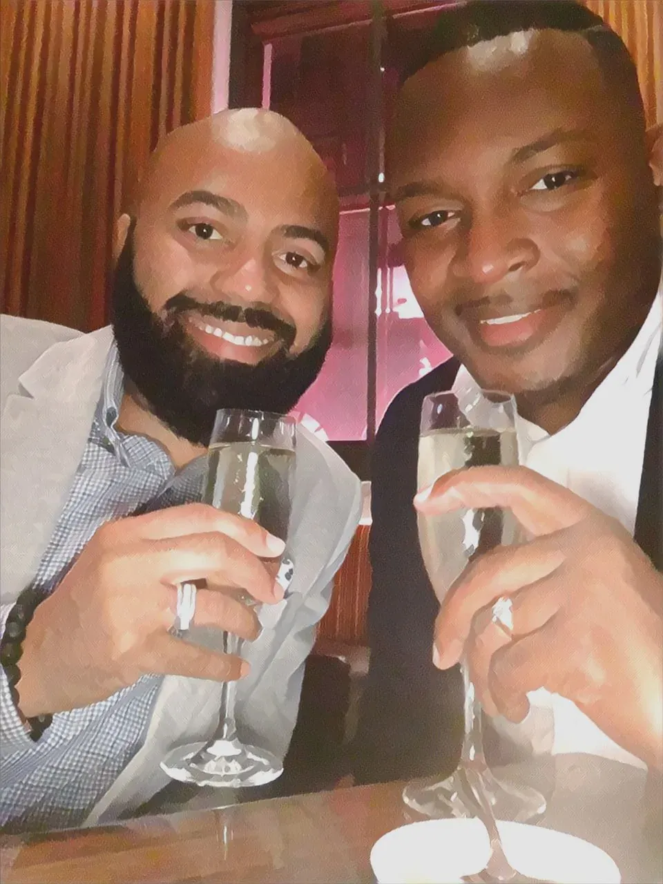 Ken and Mo raising a champagne toast
